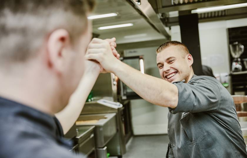 Köche geben sich high five